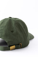 Back view of an Avelamer Caledonia Cap in Cypress Grove green with gold buckle on a white background