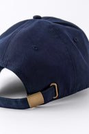 Back view of an Avelamer Caledonia Cap in Cypress Grove green with gold buckle on a white background