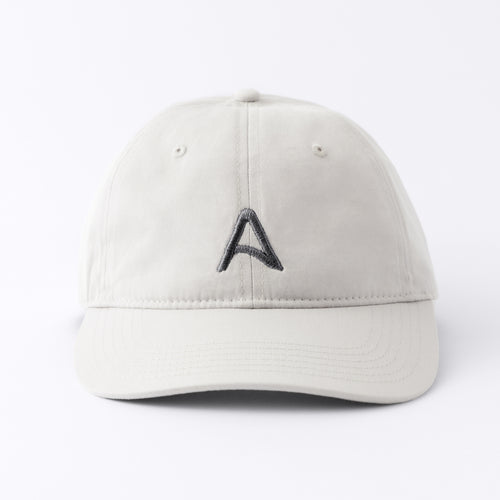 Front view of an Avelamer Caledonia Cap in Mainsail off-white with embroidered gray A-flag logo on a white background