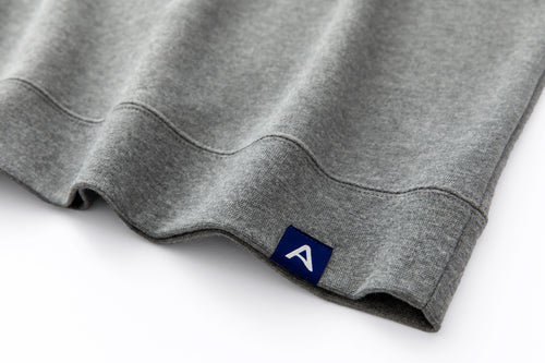 Avelamer Cazneau Crew sweatshirt in Morning Fog heather gray with a blue A-flag woven hem label.