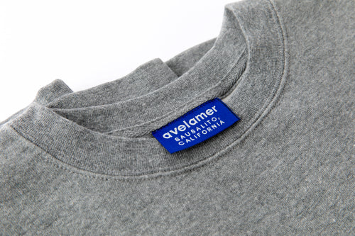 Avelamer Cazneau Crew sweatshirt in Morning Fog heather gray with a blue Avelamer Sausalito, California woven neck label.