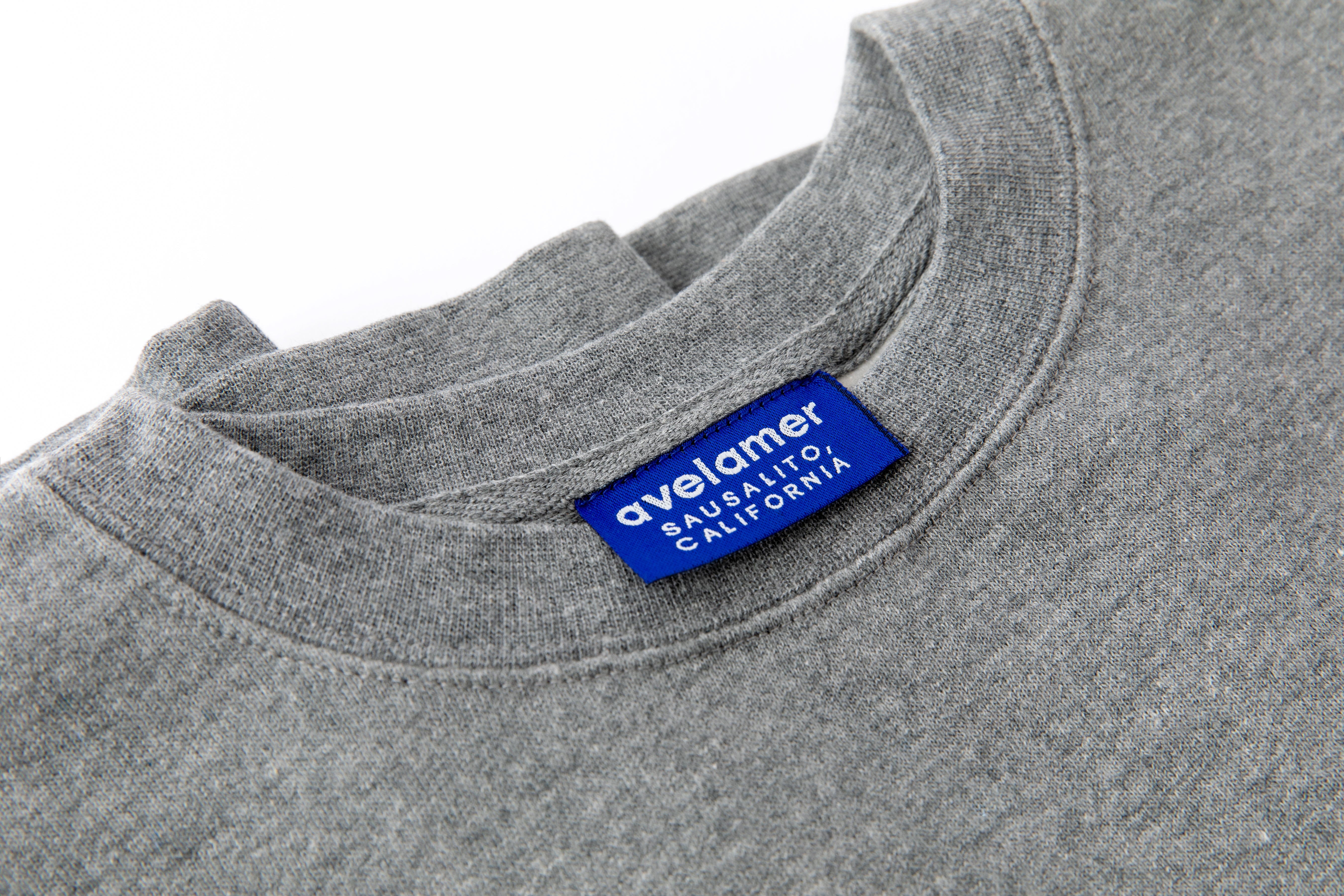 Avelamer Cazneau Crew sweatshirt in Morning Fog heather gray with a blue Avelamer Sausalito, California woven neck label.