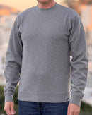 Person wearing an Avelamer Cazneau Crew in Morning Fog (heather gray) sweatshirt with an Avelamer A-flag logo woven brand hem label visible, against a blurred background