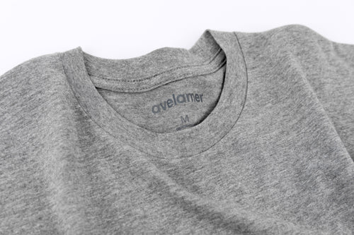 Close-up of Avelamer Ebbtide Tee in Morning Fog heather gray with printed neck label