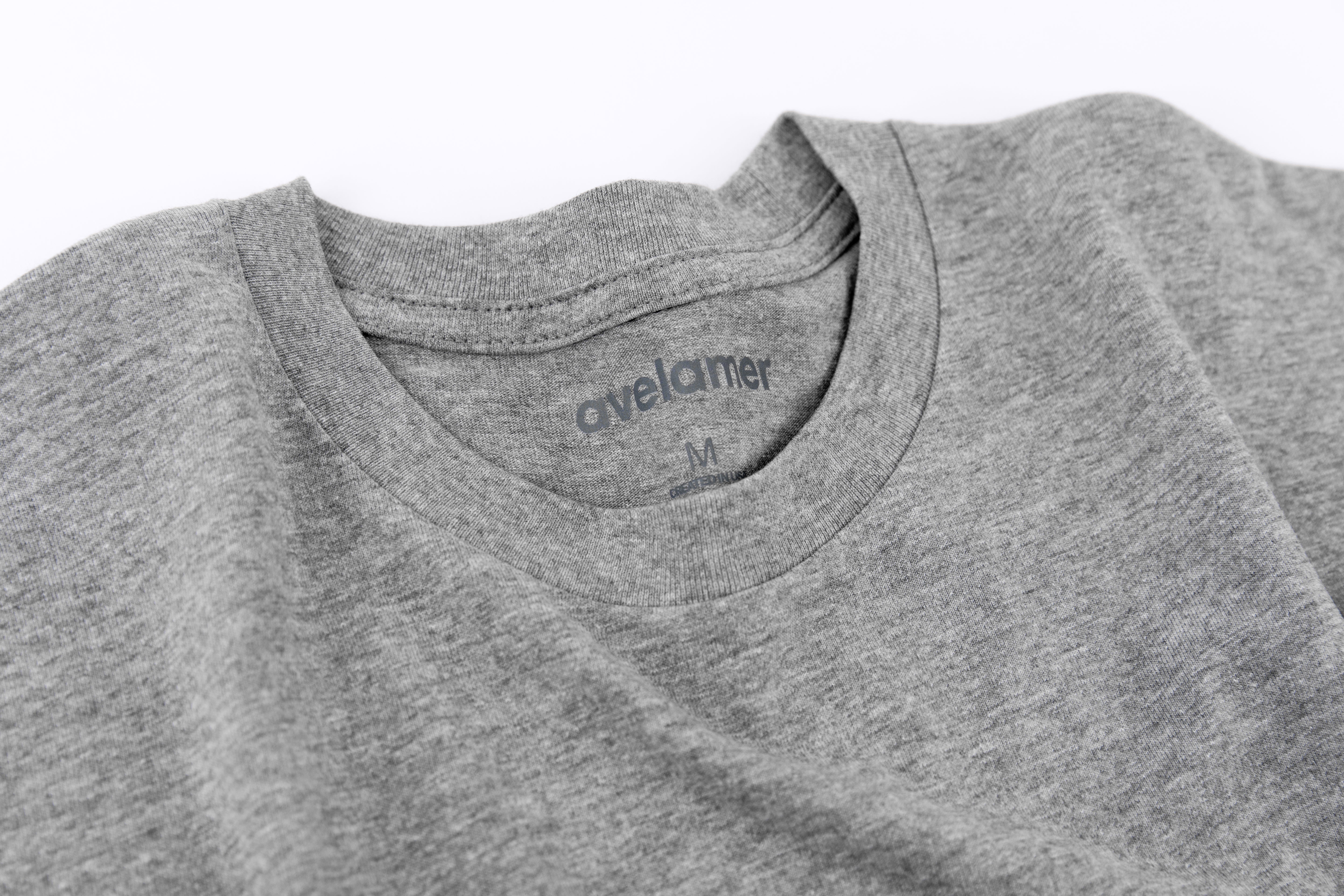 Close-up of Avelamer Ebbtide Tee in Morning Fog heather gray with printed neck label