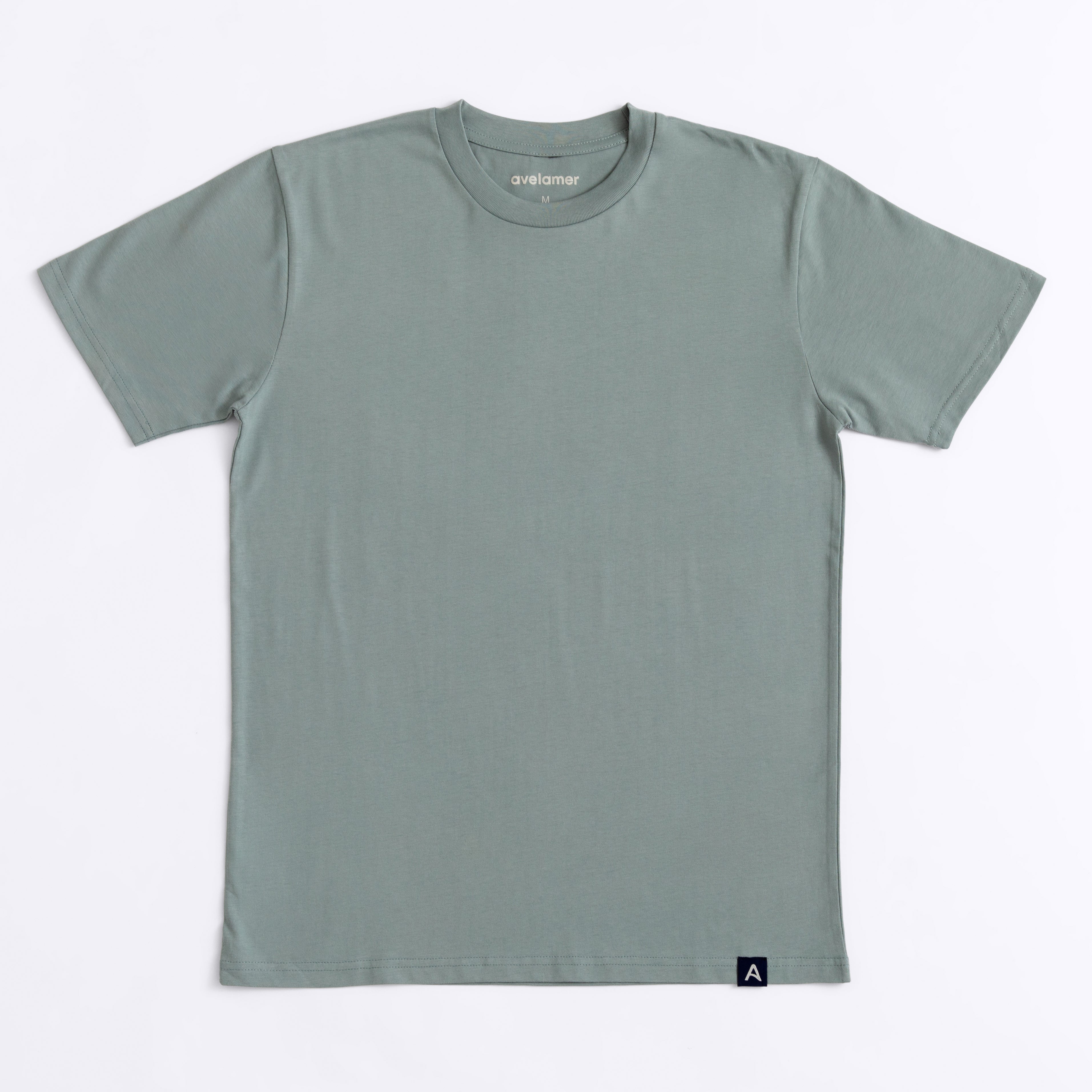 Avelamer Ebbtide Tee in Shallow Bay blue-green with printed neck label and blue A-flag logo woven hem label