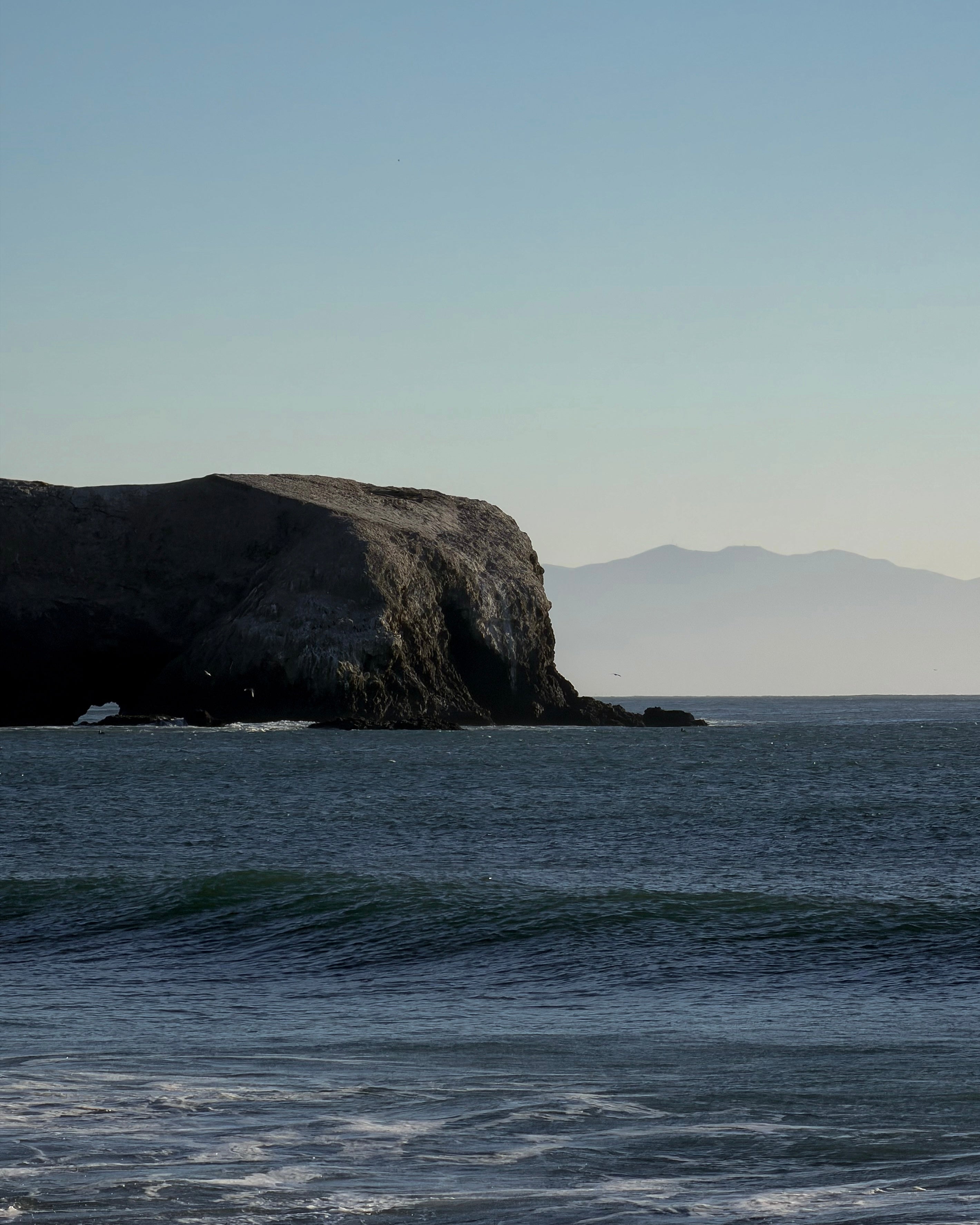 Shadow side of the Marin Headlands extending into the Pacific Ocean