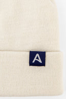 Avelamer Harbor Beanie in Mainsail off-white with blue A-flag logo woven cuff label