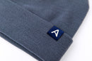 Avelamer Harbor Beanie in Ocean Slate blue gray with blue A-flag logo woven cuff label