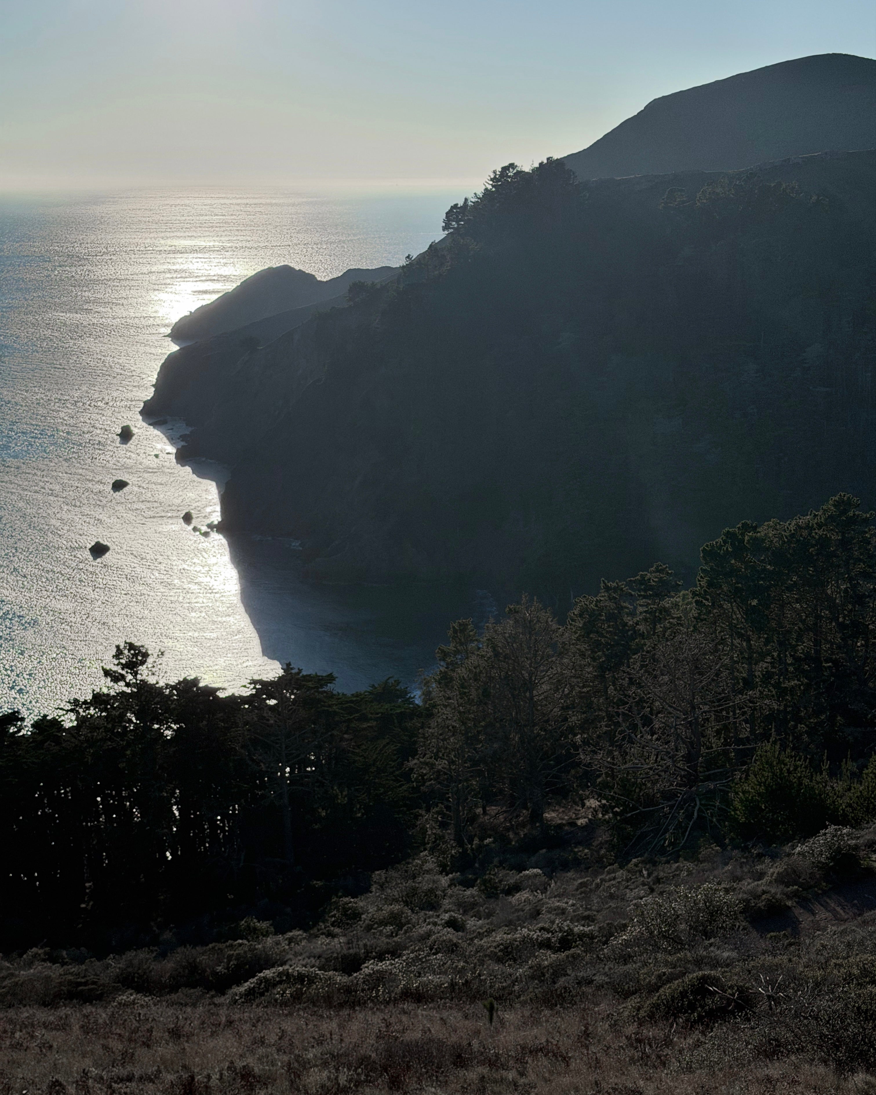 Shadow side of the Marin Headlands with late afternoon sun over the Pacific Ocean