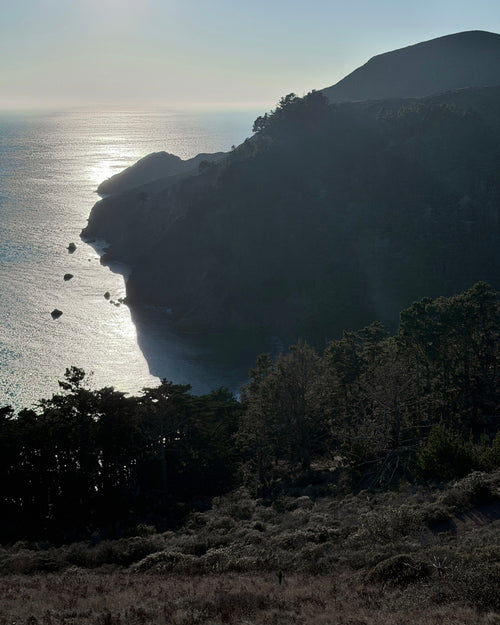 Shadow side of the Marin Headlands with late afternoon sun over the Pacific Ocean