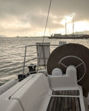 Sailboat in a Sausalito marina looking back on San Francisco Bay with fog on the horizon.
