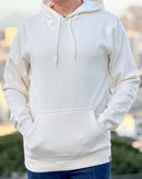 Person wearing an Avelamer Sausalito Hoodie in Mainsail off-white with a blurred background