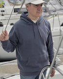 Man wearing an ocean slate blue-gray hoodie on a boat