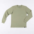Avelamer Spencer Long Sleeve tee in Bluff Sage light green with a blue Avelamer A-flag woven hem label. 