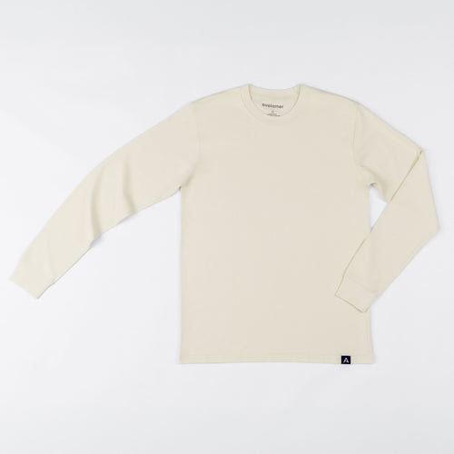 Avelamer Spencer Long Sleeve tee in Mainsail off-white with a blue Avelamer A-flag woven hem label. 